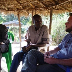 Nathan Holland with Angolan people • <a style="font-size:0.8em;" href="http://www.flickr.com/photos/62279437@N07/8646459663/" target="_blank">View on Flickr</a>